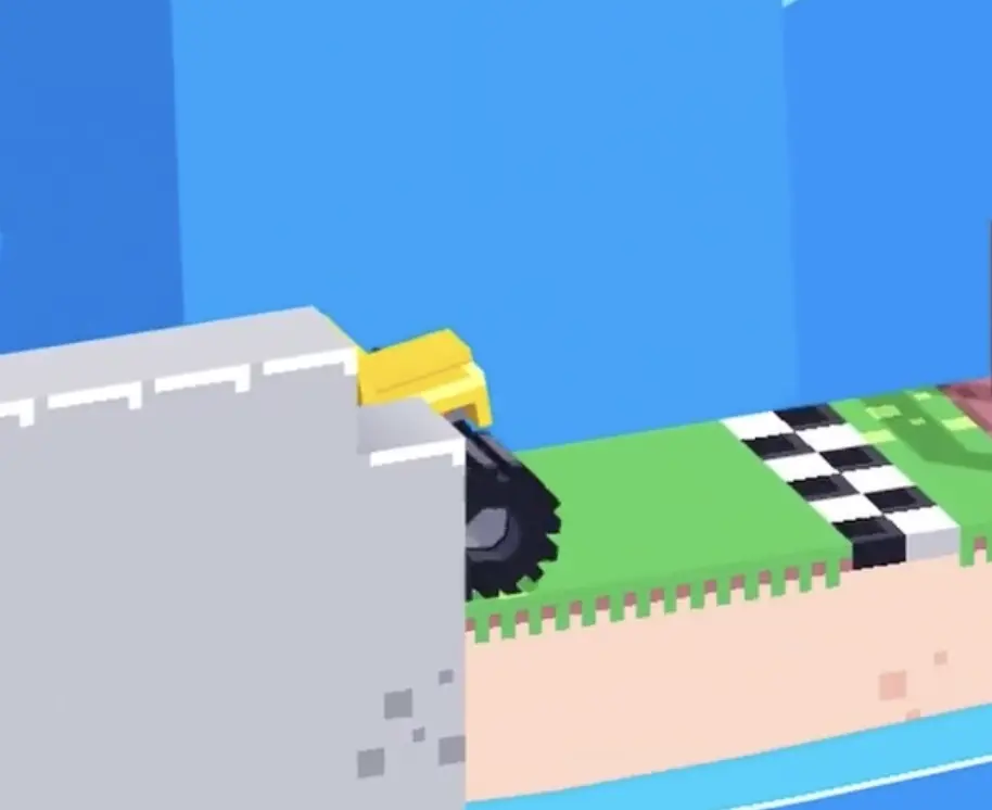 Drive Mad level 62 yellow truck emerging from behind the wall and driving toward the finish line