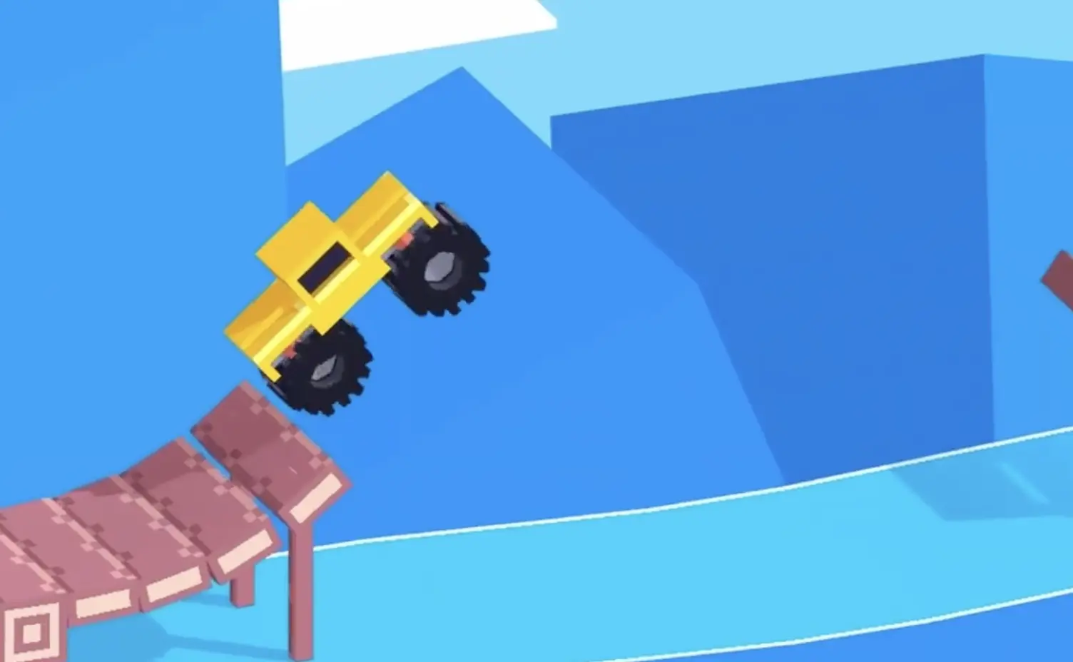 Drive Mad level 73 yellow truck airborne after leaving the curved ramp and crossing the central gap