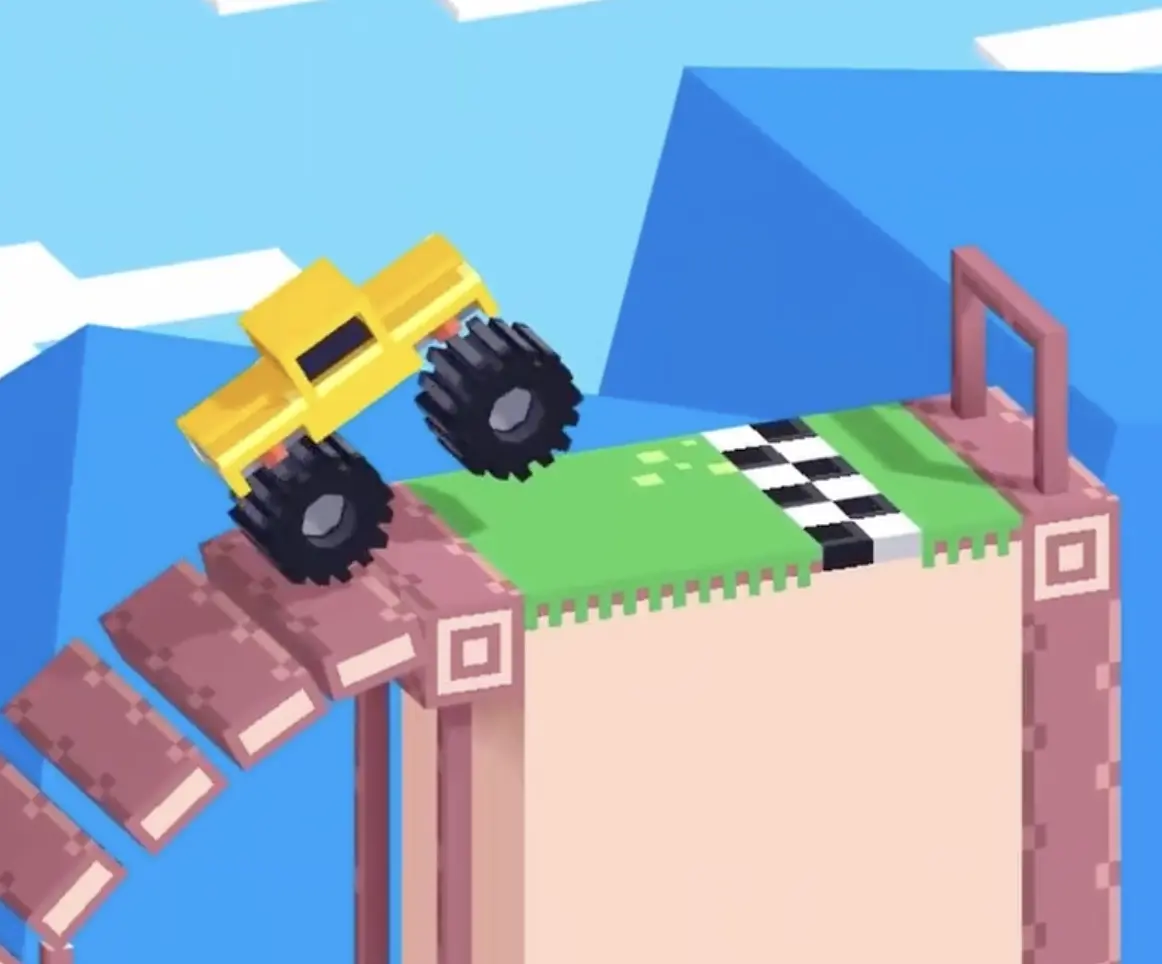 Drive Mad level 73 yellow truck coming off the final steep ramp and landing near the finish platform