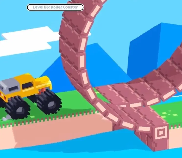 Drive Mad level 86 monster truck approaching the first large roller coaster loop with steady speed